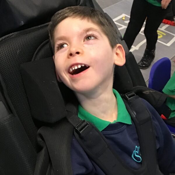 Young boy in wheelchair smiling