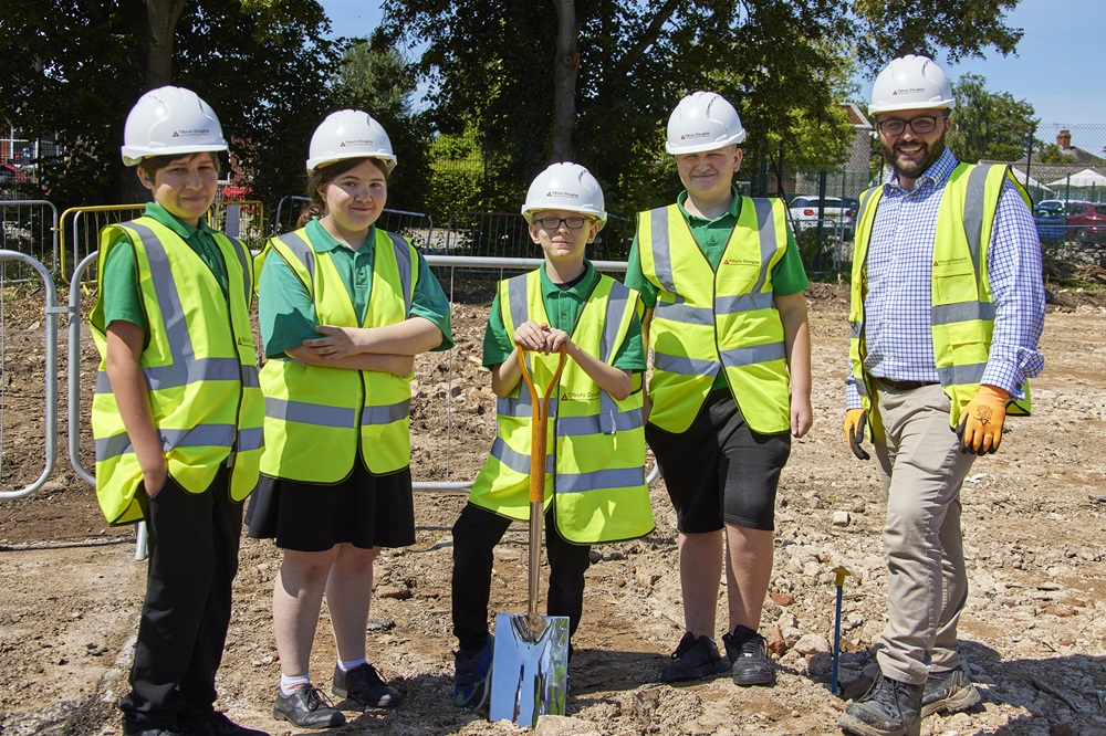 Pupils stand with the Tilbury Site Manager